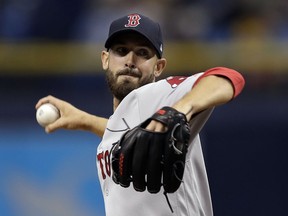 Boston Red Sox's Rick Porcello pitches to the Tampa Bay Rays during the first inning of a baseball game Saturday, March 31, 2018, in St. Petersburg, Fla.