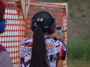 Rojin Altares, 16, fires her STI race gun at the targets during the International Practical Shooting Confederation of Canada's Alberta qualifiers, held at the Fort McMurray Fish and Game range on June 18, 2017.