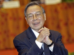 FILE - In this Sept. 28, 2009, file photo, Phan Van Khai, former prime minister of Vietnam greets during the 7th national congress of the Vietnam Fatherland Front, VFF, at the International Convention Center in Hanoi, Vietnam. The official Vietnam News Agency said Khai died at his home village on the outskirt of Ho Chi Minh City Saturday, March 17, 2018.