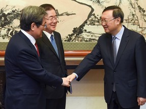 Chinese State Councilor Yang Jiechi, right, meets with South Korea's national security director Chung Eui-yong, center, and South Korean ambassador to China Noh Young-min at the Diaoyutai State Guesthouse in Beijing Monday, March 12, 2018.