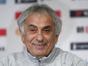 FILE - In this Nov. 9, 2017 file photo, Japan's coach Vahid Halilhodzic smiles during a press conference, in Villeneuve d'Ascq, near Lille, northern France. While established players like Shinji Kagawa and Keisuke Honda should play a big role for Japan at the World Cup, coach Vahid Halilhodzic has indicated that many spots remain open and it's time for the next generation to step up.