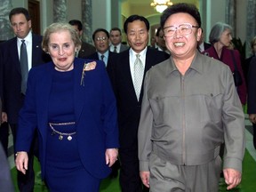 FILE - In this Oct. 23, 2000, file photo, North Korean Leader Kim Jong Il, right, and U.S. Secretary of State Madeleine Albright, left, walk towards a conference room at the Pae Kha Hawon Guest House in Pyongyang, North Korea. U.S. President Donald Trump could become the first sitting U.S. president to visit North Korea if plans for a summit with Kim Jong Un hold. But other prominent American political figures have visited Pyongyang in the past, many with a similar goal of trying to stop its nuclear program. Albright is the highest-level U.S. official to visit North Korea while in office.