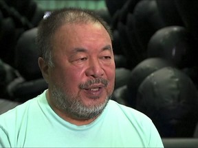 In this image made from a video, Chinese dissident artist Ai Weiwei speaks during his exhibition in Sydney, Monday, March 12, 2018.  Ai said Monday that it doesn't matter whether or not China has a change in leadership, the culture and the system will always remain the same. He launched an exhibition in Sydney to highlight the international refugee crisis. (Australia Broadcasting Corporation via AP)