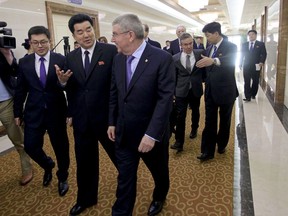 Delegation of the International Olympic Committee (IOC) led by President Thomas Bach, right, arrive at the Pyongyang Airport in North Korea, Thursday, March 29, 2018. IOC President Bach arrived in North Korea on Thursday after playing a key role in allowing it to participate in last month's Pyeongchang Olympic Games in South Korea.  At second from right in front row is North Korean Sports Minister Kim Il Guk.