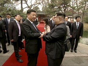 at Diaoyutai State Guesthouse in Beijing. North Korea's leader Kim and his Chinese counterpart Xi sought to portray strong ties between the neighbors and long-time allies despite a recent chill, as both countries on Wednesday confirmed Kim's secret trip to Beijing this week. (CCTV via AP Video)