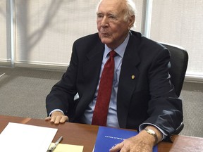 FILE - In this Jan. 15, 2015, file photo, former Idaho Gov. Cecil Andrus talks to reporters in Boise, Idaho. Congress gave final approval Friday, March 23, 2018 to a giant $1.3 trillion spending bill that ends the budget battles for now, but only after late scuffles and conservatives objections to big outlays on Democratic priorities at a time when Republicans control the House, Senate and White House. Action stalled in the Senate, as conservatives ran the clock in protest. Then, an unusual glitch arose when Sen. James Risch, R-Idaho, wanted to remove a provision to rename a forest in his home state after the late Andrus, a four-term Democratic governor.