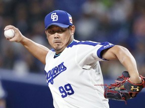 In this March 14, 2018, photo, Chunichi Dragons' Daisuke Matsuzaka pitches against the Seibu Lions during their spring training baseball game in Nagoya, central Japan. The veteran pitcher will be among several former major leaguers from Japan looking to extend their careers when the Japanese professional baseball season begins on Friday, March 30, 2018. After a disappointing stint with the Softbank Hawks of the Pacific League in 2017, the 37-year-old Matsuzaka signed with the Dragons of the Central League in the offseason.