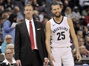 Portland Trail Blazers head coach Terry Stotts, left, and Memphis Grizzlies forward Chandler Parsons (25) talk on the sideline in the second half of an NBA basketball game Wednesday, March 28, 2018, in Memphis, Tenn.