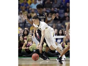 Missouri forward Michael Porter Jr. drives past Florida State guard Terance Mann (14) in the first half of a first-round game of the NCAA college basketball tournament in Nashville, Tenn., Friday, March 16, 2018.