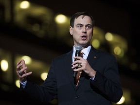 FILE - In this March 2, 2017, file photo, Tennessee new athletic director John Currie speaks during a ceremony introducing him at Thompson-Boling Arena in Knoxville, Tenn. Tennessee has reached a $2.5 million settlement with former athletic director Currie less than four months after he was suspended in the midst of a football coaching search. Currie already had received nearly $280,000 since being placed on paid leave in December. School officials announced Thursday, March 22, 2018, that Currie will get an additional $2.2 million no later than April 1.