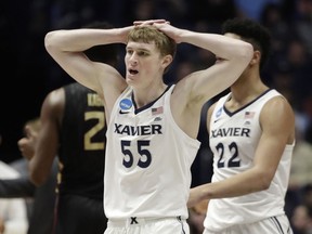 Xavier guard J.P. Macura (55) reacts to a call, during the second half of a second-round game against Florida State, in the NCAA college basketball tournament in Nashville, Tenn., Sunday, March 18, 2018.