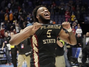Florida State guard PJ Savoy (5), celebrates after defeating Xavier in a second-round game in the NCAA college basketball tournament in Nashville, Tenn., Sunday, March 18, 2018. Florida State defeated Xavier 75-70.