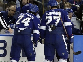 Tampa Bay Lightning right wing Ryan Callahan (24) is helped off the ice by defenseman Ryan McDonagh (27) after getting hurt during the first period of an NHL hockey game against the Toronto Maple Leafs Tuesday, March 20, 2018, in Tampa, Fla.