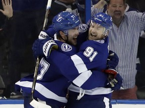 Tampa Bay Lightning defenseman Victor Hedman (77) and center Steven Stamkos (91) celebrate after Hedman scored against the Philadelphia Flyers during the third period of an NHL hockey game Saturday, March 3, 2018, in Tampa, Fla. The Lightning won the game 7-6 in a shootout.