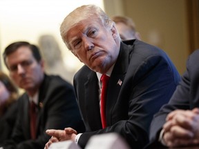 U.S. President Donald Trump listens during a meeting with steel and aluminum executives in the Cabinet Room of the White House, Thursday, March 1, 2018, in Washington.
