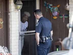 Authorities are investigating the scene in East Austin, Texas, after a teenager was killed and a woman was injured in the second Austin package explosion in the past two weeks Monday, March 12, 2018. Authorities say a package that exploded inside of an Austin home on Monday is believed to be linked to a deadly package sent to another home in Texas' capital city earlier this month.