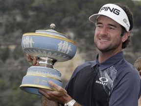 Bubba Watson holds his trophy after winning the during the final round at the Dell Technologies Match Play golf tournament, Sunday, March 25, 2018, in Austin, Texas. Watson defeated Kevin Kisner.