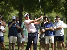 Ian Poulter hits his third shot on the 13th hole during the third round of the Houston Open golf tournament, Saturday, March 31, 2018, in Humble, Texas.