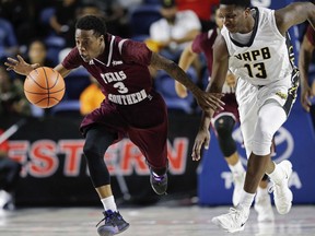 Texas Southern guard Demontrae Jefferson (3) and Arkansas-Pine Bluff guard Joe'Randle Toliver (13) chase the ball during the second half of an NCAA college basketball game in the championship of the Southwestern Athletic Conference, Saturday, March 10, 2018, in Houston.