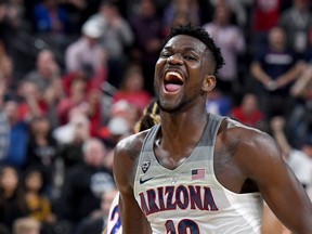 Arizona centre Deandre Ayton celebrates his team's Pac-12 championship on March 10.