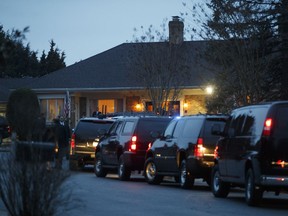 President Donald Trump's motorcade is parked in front of a private residence where the president is having dinner in McLean, Va., Tuesday, March 27, 2018.