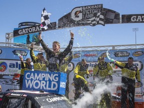 NASCAR Camping World Truck Series drivercelebrates in Victory Lane after winning the Alpha Energy Solutions 250 at Martinsville Speedway in Martinsville, Va., Monday, March 26, 2018.