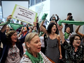 Activists cheer in favor of legalized abortion during the presentation of an abortion bill at Congress in Buenos Aires, Argentina, Tuesday, March 6, 2018. Under heavy pressure by women's groups that have taken to the streets in large numbers in recent years, over 70 legislators presented an abortion bill that will be first be discussed in several committees of the lower chamber.