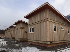 Tiny homes are shown in Bella Coola, B.C. in a handout photo. Members of a small B.C. First Nation have been working to build a tiny solution to homelessness in their community. In about a month's time, a colony of tiny homes in the Nuxalk First Nation in Bella Coola will open its doors to four single men who are homeless or at risk of homelessness.