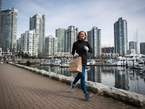 Melanie Knight carries a bag for any litter she sees while jogging along the False Creek seawall, a fitness trend from Sweden called plogging, in Vancouver, B.C., on Wednesday March 21, 2018. The term plogging combines jogging and the Swedish term "plocka upp," which means pick up.