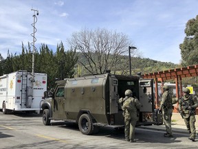 Law enforcement members stage near the Veterans Home of California after reports of an active shooter Friday, March 9, 2018, in Yountville, Calif.