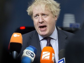 British Foreign Secretary Boris Johnson speaks with the media as he arrives for a meeting of EU foreign ministers at the Europa building in Brussels on Monday, March 19, 2018. European Union foreign ministers on Monday are set to discuss Ukraine, Syria, Korea and Iran.