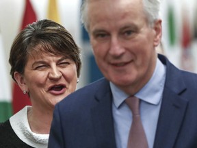 Leader of the Democratic Unionist Party Arlene Foster, left, speaks with European Union chief Brexit negotiator Michel Barnier prior to a meeting at EU headquarters in Brussels on Tuesday, March 6, 2018.
