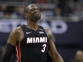 Miami Heat guard Dwyane Wade reacts after a foul during the overtime period an NBA basketball game against the Washington Wizards, Tuesday, March 6, 2018, in Washington. The Wizards won 117-113.