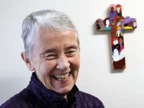 In this Thursday, March 22, 2018, photo, Sister Judy Byron, director and coordinator of the Northwest Coalition for Responsible Investment, poses for a photo in her office in Seattle. The investment fund BlackRock owns $6 trillion in assets, including big stakes in three different gun makers, but it might end up working alongside a group of nuns. Byron says her group and BlackRock appear have similar ideas when it comes to gun manufacturers and retailers.
