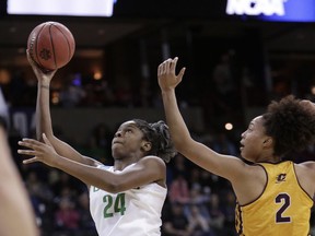 Oregon forward Ruthy Hebard (24) shoots in front of Central Michigan forward Tinara Moore (2) during the first half in a regional semifinal at the NCAA women's college basketball tournament, Saturday, March 24, 2018, Spokane, Wash.