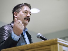 FILE - In this Feb. 8, 2018, file photo, Randy Bryce, a Democratic primary candidate for the 1st Congressional District, addresses supporters at the United Automobile Workers building in Janesville, Wis. National Democrats are endorsing ironworker Bryce in the Wisconsin congressional primary battle for the right to challenge Republican House Speaker Paul Ryan in the November midterm elections.