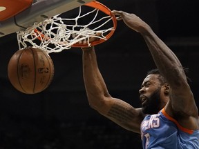 LA Clippers' DeAndre Jordan dunks during the first half of an NBA basketball game against the Milwaukee Bucks Wednesday, March 21, 2018, in Milwaukee.