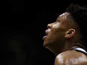 Milwaukee Bucks' Giannis Antetokounmpo watches during the first half of an NBA basketball game against the LA Clippers Wednesday, March 21, 2018, in Milwaukee.