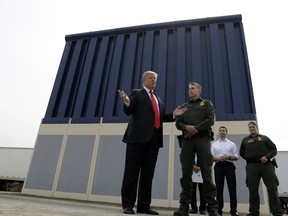 President Donald Trump reviews border wall prototypes, Tuesday, March 13, 2018, in San Diego. During the visit Trump said, "It will save thousands and thousands of lives, save taxpayers hundreds of billions of dollars by reducing crime, drug flow, welfare fraud and burdens on schools and hospitals. The wall will save hundreds of billions of dollars -- many, many times what it is going to cost. ... We have a lousy wall over here now but at least it stops 90, 95 percent. When we put up the real wall, we're going to stop 99 percent, maybe more than that." However, Congress' main watchdog found that the government does not have a way to show how barriers prevent illegal crossings from Mexico. A Government Accountability Office report last year said U.S. Customs and Border Protection "cannot measure the contribution of fencing to border security operations along the southwest border because it has not developed metrics for this assessment."