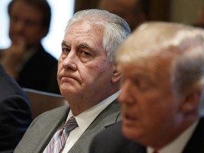 FILE - In this Jan. 10, 2018 file photo, Secretary of State Rex Tillerson listens as President Donald Trump speaks during a cabinet meeting at the White House in Washington. Tillerson is out as secretary of state. President Trump tweeted this morning that he's naming CIA director Mike Pompeo to replace him.