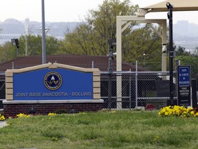 FILE - This April 17, 2013 file photo shows the gate for the Joint Base Anacostia-Bolling in Washington. The Defense Department says they are tracking the delivery of suspicious packages to multiple military installations in the Washington, region. The FBI's Washington field office said in a statement that the bureau "responded to multiple government facilities" on March 26, 2018, "for the reports of suspicious packages." According to the accounts, the sites included Joint Base Anacostia-Bolling in the district and at Fort Belvoir, in Virginia.