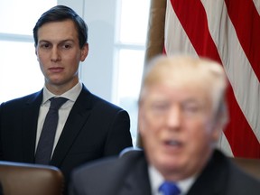 FILE - In this Dec. 20, 2017 file photo, White House senior adviser Jared Kushner listens as President Donald Trump speaks during a cabinet meeting at the White House in Washington. Kushner has lost his access to the nation's deepest secrets, which could be problematic in his role overseeing the Trump administration's efforts to produce Mideast peace.