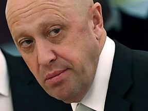 FILE - In this July 4, 2017 file photo, Russian businessman Yevgeny Prigozhin is shown prior to a meeting of Russian President Vladimir Putin and Chinese President Xi Jinping in the Kremlin in Moscow, Russia. Russian operatives working for Yevgeny Prigozhin, a Russian oligarch with ties to Russian President Vladimir Putin, used a network of fake social media accounts and targeted messaging to roil the national debate in the 2016 election, prosecutors allege.