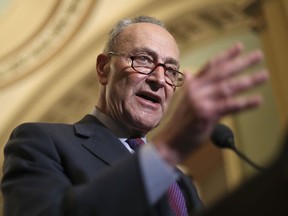 In this March 6, 2018, photo, Senate Minority Leader Chuck Schumer of N.Y., speaks with reporters following weekly policy luncheons on Capitol Hill in Washington. Senate Democrats have a plan to reverse some of the tax breaks and put the money instead toward a $1 trillion infrastructure package. The proposal is more campaign theme than actual legislative agenda, since Republicans hold the majority in Congress. "The bottom line is very simple," Schumer told The Associated Press. "The vast majority of Americans would much prefer new, 21st century infrastructure than tax breaks for the wealthiest of people."