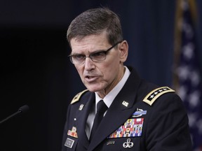 FILE - In a Aug. 30, 2016, file photo, U.S. Central Command Command Commander, Army Gen. Joseph Votel, speaks to reporters at the Pentagon. U.S. military leaders are considering new guidelines for the use of helmet cameras on the battlefield after Islamic State-linked fighters in Niger exploited footage taken by a fallen American soldier to make a propaganda video that highlighted the killing of four U.S. forces.