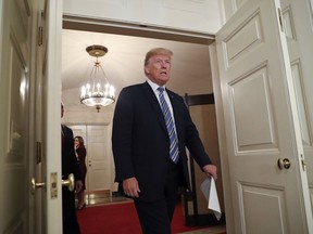 In this March 23, 2018, photo, President Donald Trump walks into the Diplomatic Room of the White House in Washington, to speak about the $1.3 trillion spending bill. Days of conflicting and misleading statements from Trump and his top aides have fueled new questions about the White House's credibility. That's sowing mistrust and instability within the West Wing and leaving some congressional Republicans wondering if they have a good faith negotiating partner in the president.