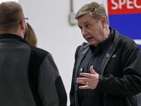 In this March 5, 2018, photo, Republican Rick Saccone, right, talks with supporters at a campaign rally in Waynesburg, Pa. Saccone is running against Democrat Conor Lamb in a special election being held on March 13 for the PA 18th Congressional District vacated by Republican Tim Murphy.