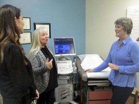 In this Feb. 8, 2018, photo, Blayne Wittig, executive director of Options for Women of California, left, a center in Concord, Calif., Debbie Whittaker, nurse manager, center, and Christine Vatuone, president and CEO of Informed Choices, talk at Informed Choices, a crisis pregnancy center in Grilroy, Calif. A California law regulating anti-abortion pregnancy centers has led to a Supreme Court clash at the intersection of abortion and free speech. The centers say a law requiring them to tell pregnant clients the state has family planning and abortion care available at little or no cost violates the centers' free speech rights. Informed Choices is what Vatuone describes as a "life-affirming" pregnancy center. Even as it advertises "free pregnancy services" and promises in signs on its door and inside to discuss all options with pregnant women, Informed Choices exists to steer women away from abortion.