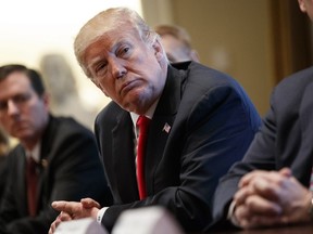 President Donald Trump listens during a meeting with steel and aluminum executives in the Cabinet Room of the White House, Thursday, March 1, 2018, in Washington. U.S. President Donald Trump's trade offensive just drew its first serious opposition at home. And that's good news for Canada, policy experts say.