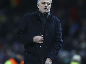 Manchester United head coach Jose Mourinho walks from the pitch after the end of the Champions League round of 16 second leg soccer match between Manchester United and Sevilla, at Old Trafford in Manchester, England, Tuesday, March 13, 2018. Sevilla won the game 2-1 and go through to the quarterfinals .